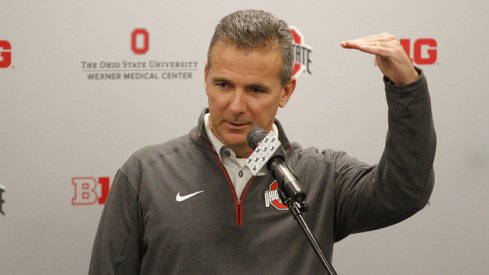 Urban Meyer showing how much he loves fielding calls.