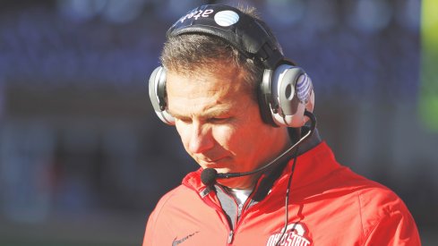 Urban Meyer strolls the sidelines.