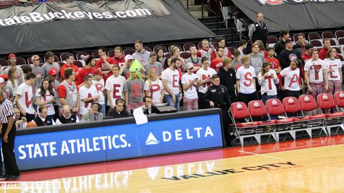 Ohio State students with a cry for help from Penn State