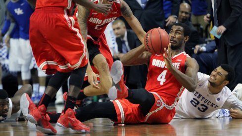 Daniel Giddens scrambles for a loose ball against Kentucky. 