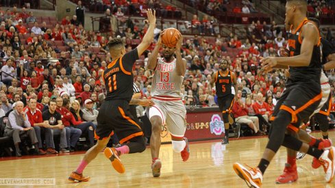 JaQuan Lyle drives inside against Mercer.