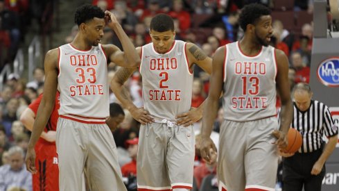 Keita Bates-Diop, Marc Loving and JaQuan Lyle walk off the floor.