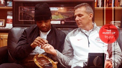 Keandre Jones and Urban Meyer examine some Buckeye hardware.