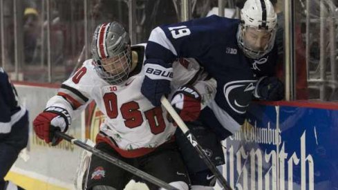 Ohio State's Janik Moser and Penn State's Eric Scheid do battle along the wall.