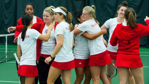 Women's tennis team celebrates victory over rival Michigan