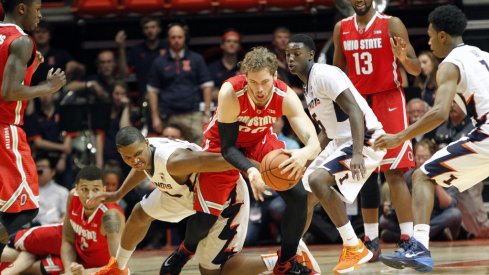 Mickey Mitchell comes up with a loose ball in OT against the Illini.