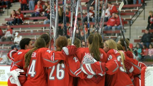 The Ohio State women's hockey team huddles up.