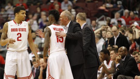 Thad Matta gives instructions to Marc Loving and Kam Williams.