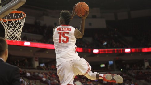 Kam Williams skies for a pregame dunk.