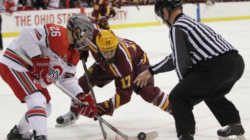 Ohio State's Mason Jobst faces off against Minnesota's Tommy Novak