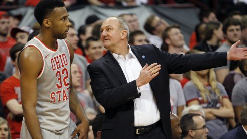 Thad Matta talks to Trevor Thompson during Tuesday's game against Michigan.