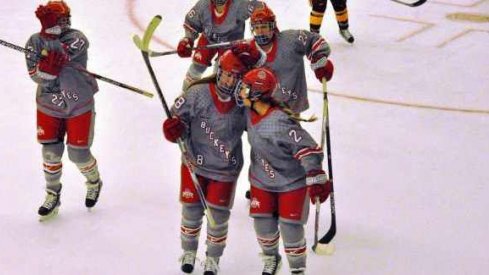 Ohio State women's hockey seniors Kendall Curtis and Cara Zubko skate off the ice.