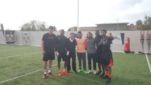 Mike Irvin tutoring Braxton Miller and Michael Thomas