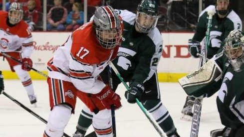 Ohio State forward David Gust goes to the net against Michigan State. 