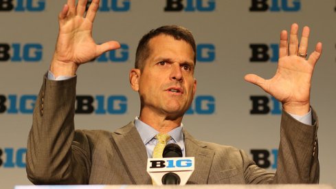 Jim Harbaugh takes a jab at Gene Smith