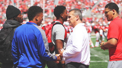 Urban Meyer surrounded by Buckeye recruits. 