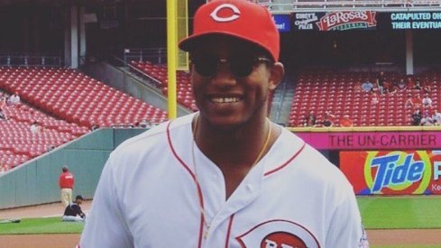 Darron Lee throws first pitch at Cincinnati Reds game.