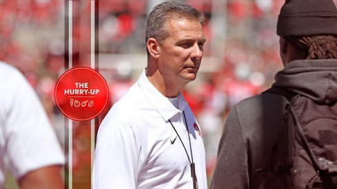 Urban Meyer talking to Najee Harris.