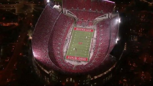 Ohio Stadium under the lights look back.