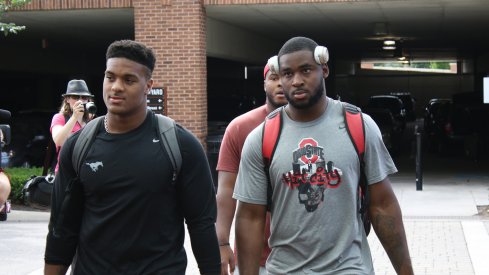 Dre'Mont Jones and Darius Slade check in for fall camp. 