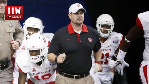 Tom Herman leads the Houston Cougars to the field for the Peach Bowl