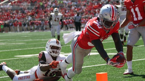 DeMario McCall scores a touchdown.