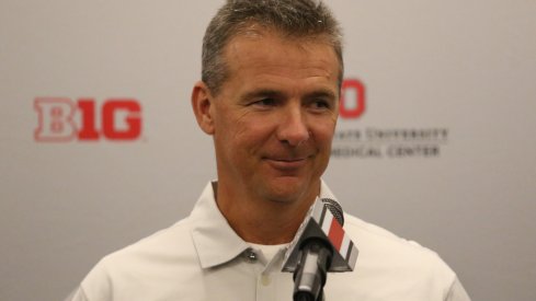 Urban Meyer at the podium. 