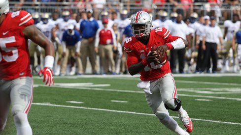 J.T. Barrett runs around for a short gain against Tulsa. 