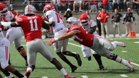 Nick Bosa, Jalyn Holmes get after the Rutgers quarterback. 