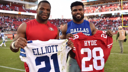 Guapo and Zeke trade jerseys.