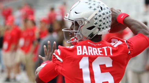 Ohio State quarterback J.T. Barrett warms up Saturday vs. Rutgers.