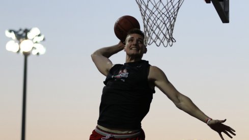 Ohio State freshman Micah Potter soars in warmups. 