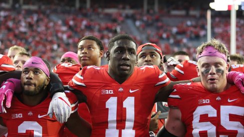 Marshon Lattimore, Jalyn Holmes, and Pat Elflein sing Carmen Ohio after beating Indiana.