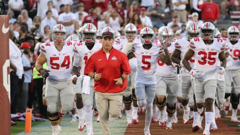 Ohio State players run onto the field at Oklahoma