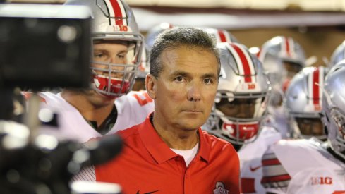 Urban Meyer leads his team on the field against Oklahoma. 