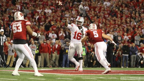 Ohio State quarterback J.T. Barrett lets go of a pass against Wisconsin. 