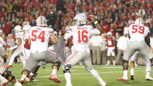 J.T. Barrett drops back to pass vs. Wisconsin. 