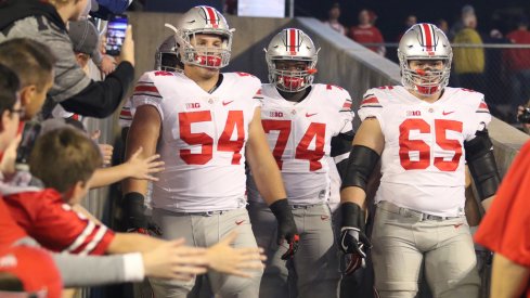 Billy Price, Jamarco Jones and Pat Elflein take the field at Wisconsin. 