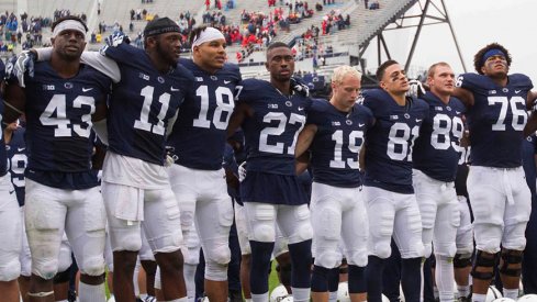 Penn State football players celebrate the team's win over Maryland.