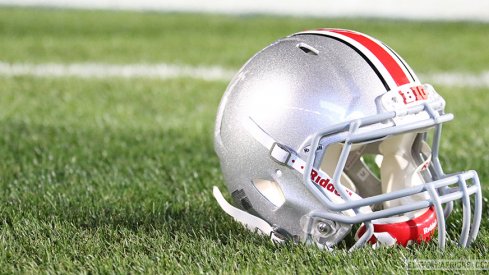 Ohio State helmet on the field at Penn State's Beaver Stadium.