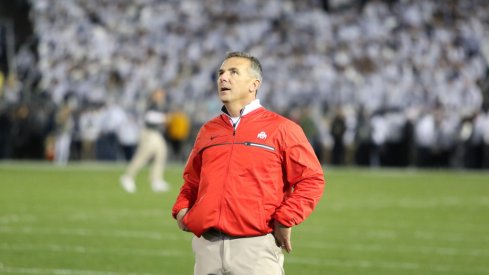 Urban Meyer gazes up at the Beaver Stadium scoreboard. 