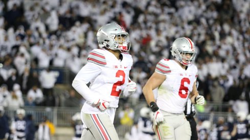 Marshon Lattimore and Sam Hubbard jog off the field following a series at Penn State. 