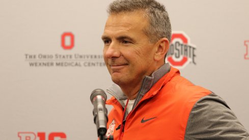 Urban Meyer flashes a smile at a press conference. 