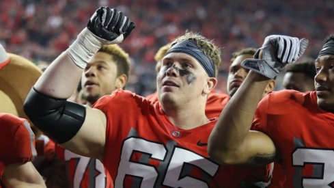 Pat Elflein celebrates an Ohio State victory with his teammates.