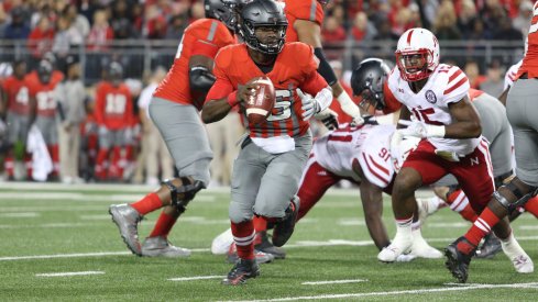 J.T. Barrett scrambles and keeps his eyes downfield against Nebraska. 