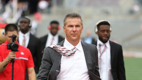 Urban Meyer walks into Ohio Stadium. 