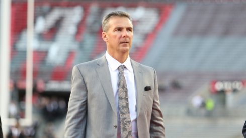 Urban Meyer walks into Ohio Stadium prior to the game against Nebraska. 