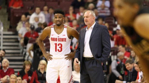 Thad Matta talks with Ohio State point guard JaQuan Lyle. 