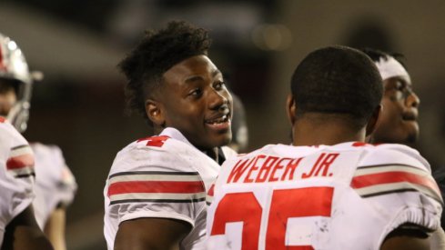 Curtis Samuel chats with Mike Weber during the game against Maryland.