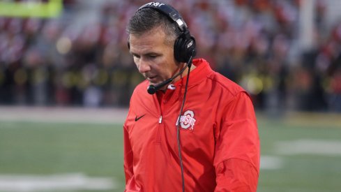 Urban Meyer strolls the sidelines at Maryland. 